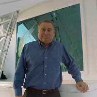 Dan Del Monte standing on a boat